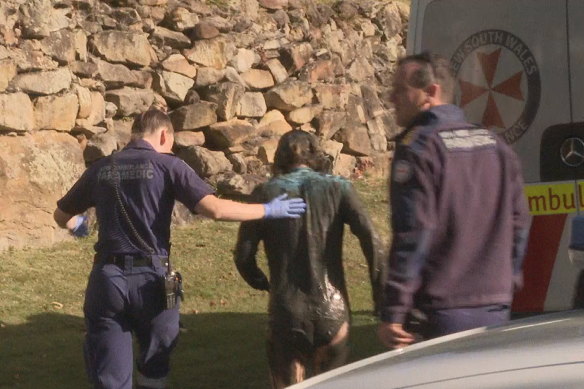 The woman was rescued after she became stuck in mud in the Georges River.