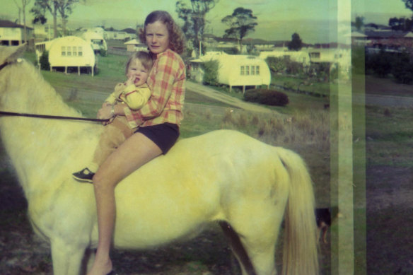 Sonia Roberts with nephew Paul in 1968 near the Nissen huts in Belmont North near Newcastle.