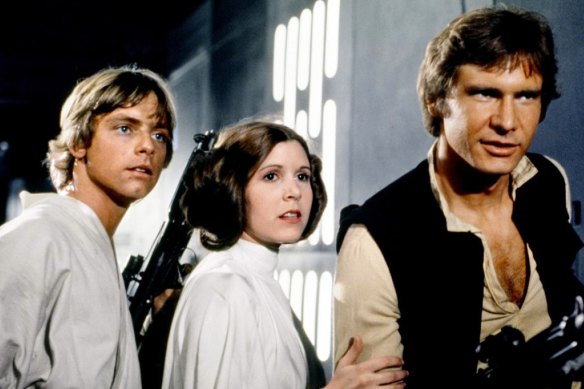 Where it all began … Mark Hamill, Carrie Fisher and Harrison Ford in the 1977 film Star Wars.
