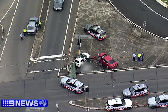 Two women are dead after a man allegedly led police on an hour-long chase across Sydney’s south-west in a stolen vehicle and crashed into their car, before being arrested at gunpoint.