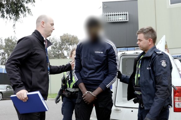 Police arrest an alleged offender in Cheltenham. Fifty-seven young people were arrested across the state. 