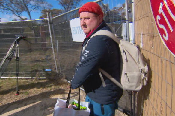 A Russian diplomat leaves the proposed Russian embassy site deemed too close to Parliament House in Canberra.