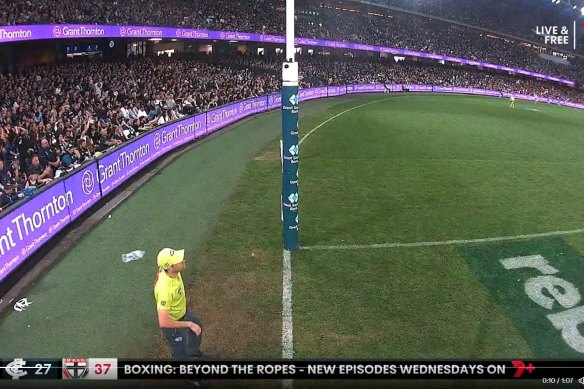 A water bottle is seen being thrown at the goal umpire.