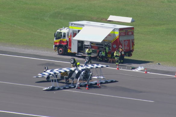 A vintage biplane has crashed at Shellharbour Airport, landing upside down on the runway while attempting to touch down.