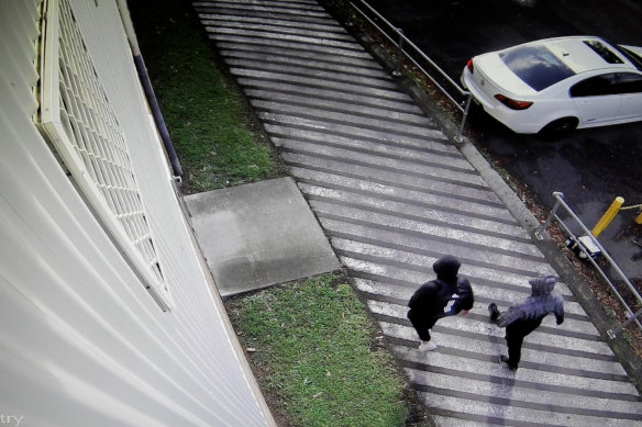 Two men walking near the Kelso Park Soccer Club shortly after the murder.