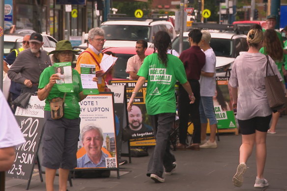 Volunteers outside a voting booth in Prahran electorate on Saturday.