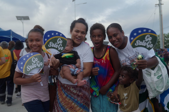 Junita Javi (right) with her four children outside the Pacific Games stadium. 