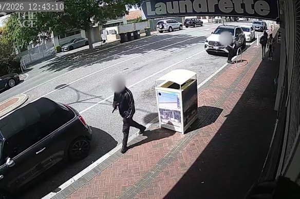 A man armed with a machete captured on CCTV at a shopping strip in Rivervale.