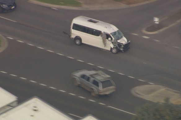 A driver climbs out a van that was pursued by police across Melbourne.