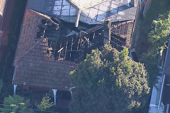 Aerials show the collapsed roof of a Croydon house after fire tore through the property. 