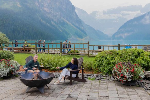 Savour fireside luxury and pristine emerald waters outside the Fairmont Chateau Lake Louise. 