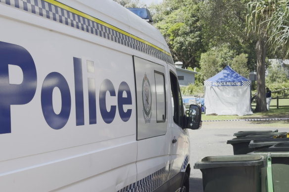 Police at the scene where a woman’s body was found in a car boot.