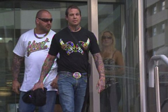 Murder accused man David Pye walking out of court in 2013 in front of his former ally and alleged victim, Nick Martin.