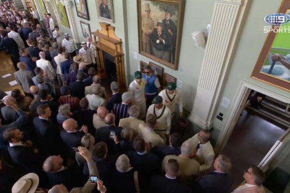 Australian opener Usman Khawaja walks past MCC members inside Lord’s famous Long Room after Jonny Bairstow’s controversial dismissal.