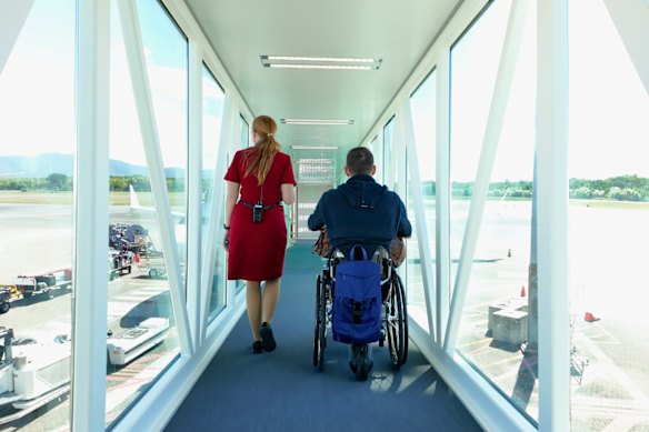 Shane Hryhorec boarding a flight to Japan. Travelling in a wheelchair is totally possible… but the travel industry just needs to get on board.