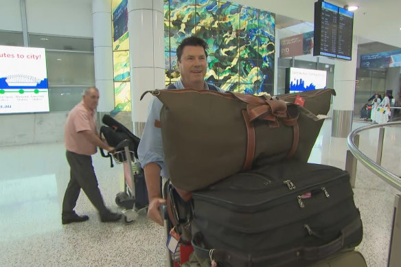 Pack your bags – Rugby Australia chairman Hamish McLennan arrives at Sydney Airport on Wednesday.