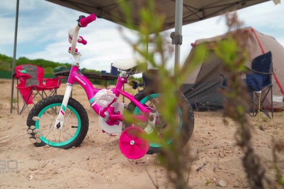 Cloe’s bike outside the family camp site on a remote beach north of Carnarvon in Western Australia.