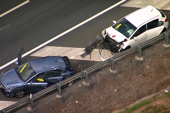 The man and car were struck when waiting at a Logan Motorway emergency bay.