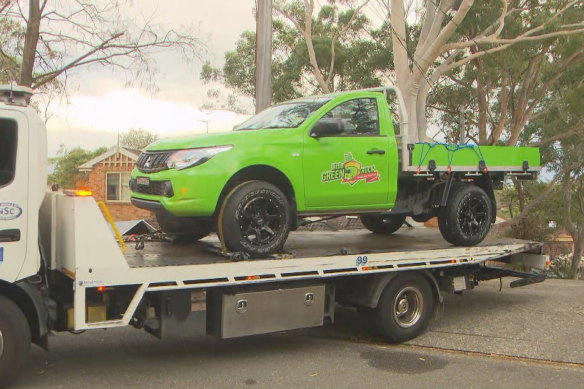 A vehicle is removed from the home on Kita Road, Berowra Heights on Friday.