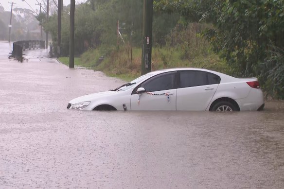 Rainfall has been causing floods across Sydney and the NSW South Coast, including this road in Dapto. 