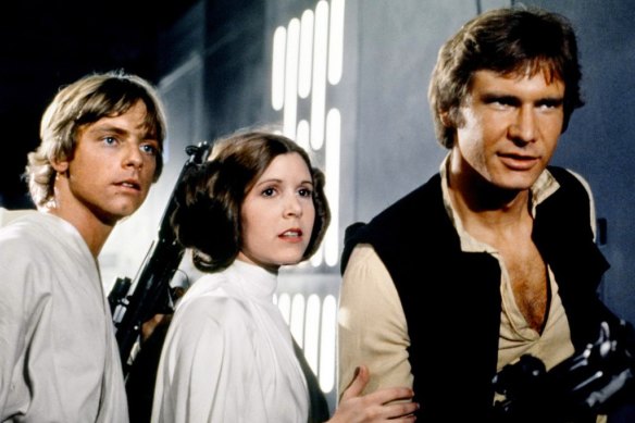 Mark Hamill, Carrie Fisher and Harrison Ford in the 1977 film Star Wars.