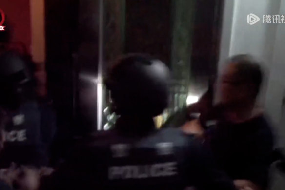 A video still of Chinese police raids in Fiji in 2017.