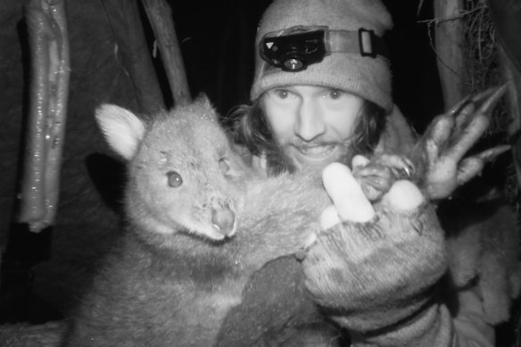 Shay Williamson on season three of Alone Australia with prize pademelon catch. 