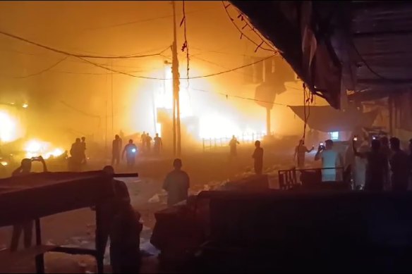 A screen grab captured from a video shows fire caused by Israeli airstrike on Nuseirat Refugee Camp in Gaza City, Gaza on October 21. 