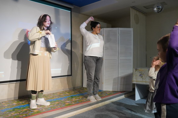 Educators teaching children in a child-friendly space in an underground bunker in Dnipro, Ukraine.