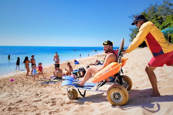 The Wheel Around the World creator hits the beach in Queensland.