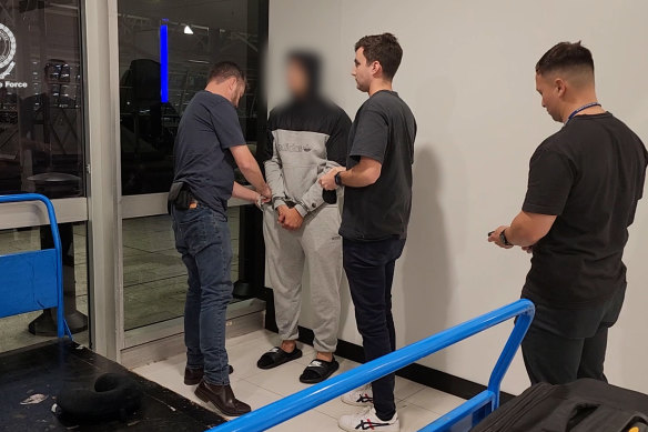 Detectives from Strike Force Mylor arrest Mohommed Farhat at Sydney Airport on November 25.