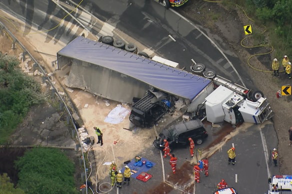 The truck fell onto two cars. 