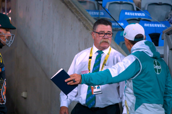 Justin Langer vents his frustration with match referee David Boon at Manuka Oval during a T20 international between Australia and India in 2020. 
