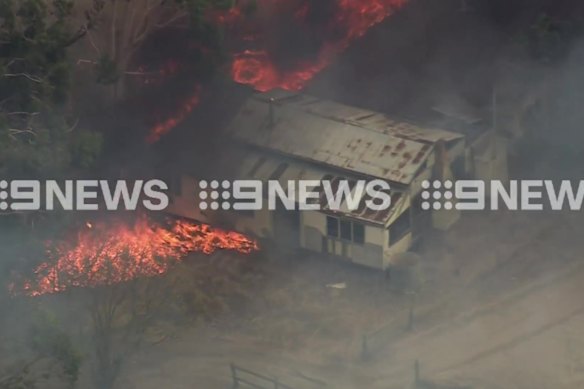 A property is burning as a bushfire continues in Beechina, east of Perth.
