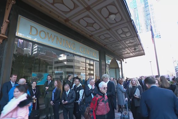 Thousands of people evacuated the Downing Centre court complex on Tuesday after a burst water main led to a power outage.
