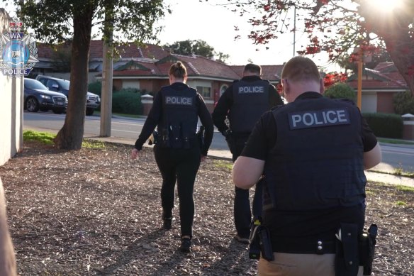 Police raid one of the Perth properties. 