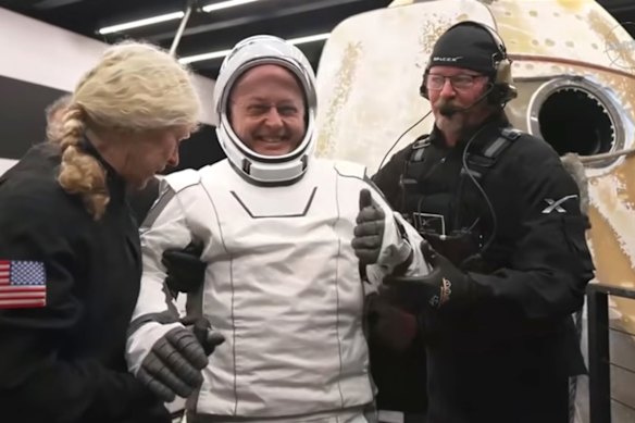 NASA astronaut Mike Fincke receives assistance from the SpaceX Crew-11 capsule after re-entering Earth during a midnight splashdown near San Diego, California.