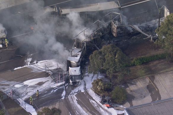 Firefighters work to contain the blaze.  