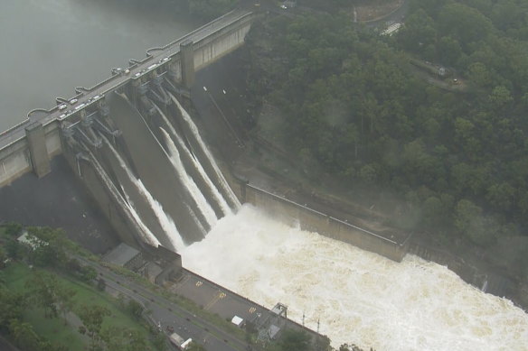 Floodwater spills over Warragamba Dam on Sunday.