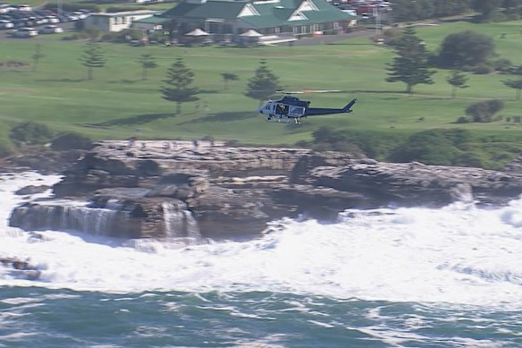 A PolAir helicopter searched the waters near Little Bay.
