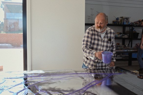Dale Frank starts a work by pouring pigments onto perspex. 