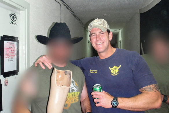Ben Roberts-Smith with a novelty drinking vessel made from the prosthetic leg of an Afghan man he had killed.
