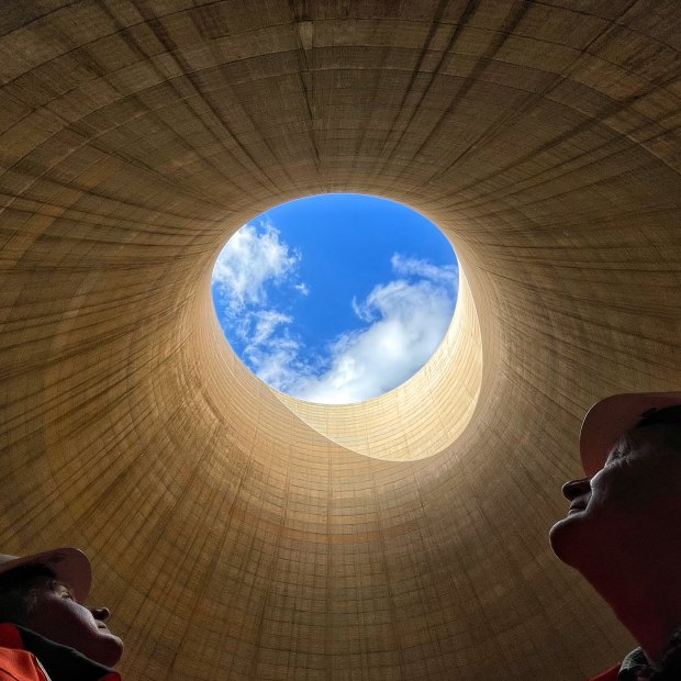The ultimate echo chamber: Greenspot chief executive Brett Hawkins (left) and part owner Neil Schembri look skyward from inside the cooling tower of the shuttered Wallerawang Power Station. 