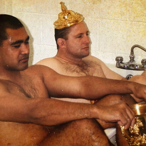 Toutai Kefu (left) and Dan Crowley take a bath after the Wallabies' 1999 Rugby World Cup Victory.