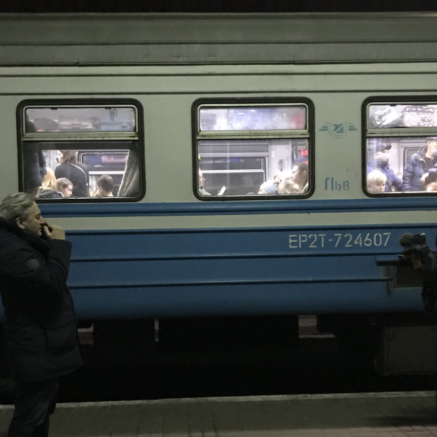 Nik Millard (right) captures a platform farewell in Lviv, Ukraine.