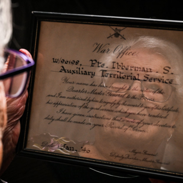 Sonja Cowan with a certificate of merit from the British Army that she earned during World War II.