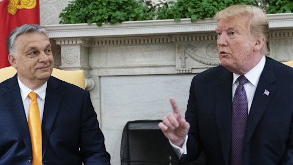 US President Donald Trump, right, speaks while Viktor Orban, Hungary's prime minister, listens.