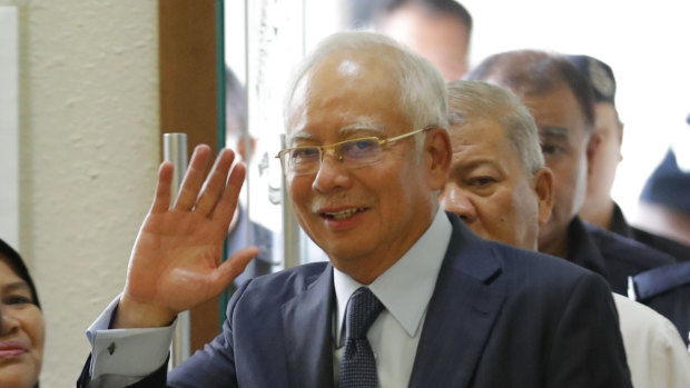 Former Malaysian prime minister Najib Razak walks into a court room at Kuala Lumpur High Court in October. 