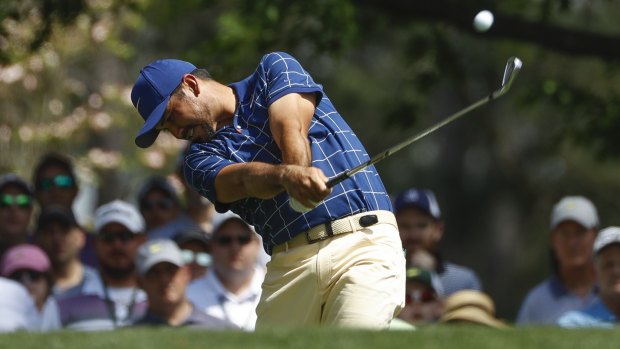 Playing through pain: Jason Day on the fourth hole during his first round at the Masters.