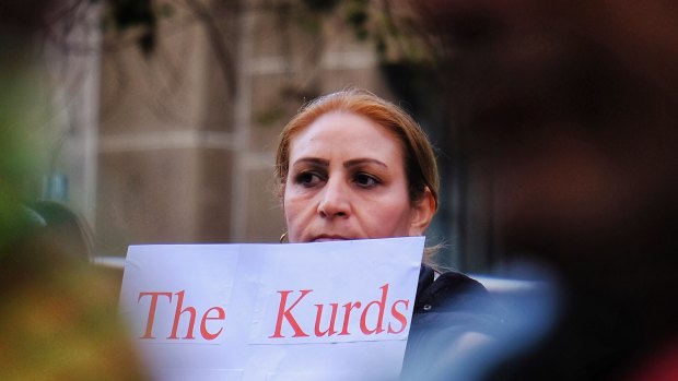 Australia's Kurdish community rallies in front of the State Library in Melbourne on Saturday. 